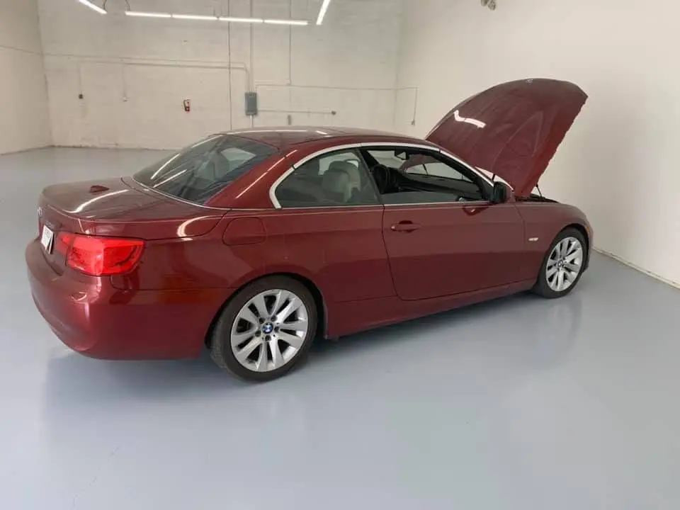 BMW convertible undergoing mechanical repair inside the Chandler service bay