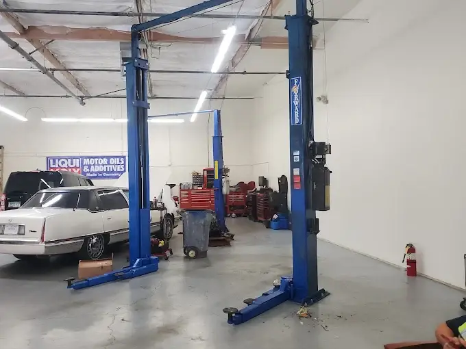 Interior of the Valette Auto Repair service bay with vehicle lifts and diagnostic equipment